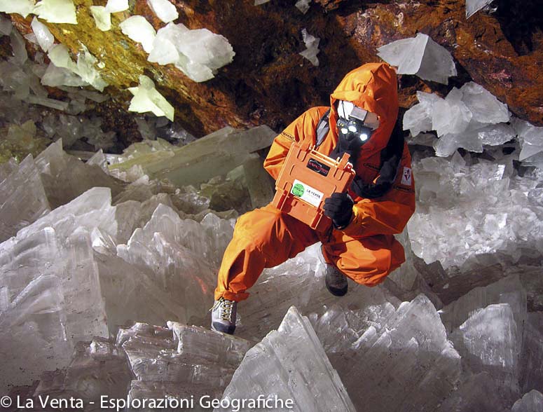 Scientist examines crystal in Cave of the Crystals